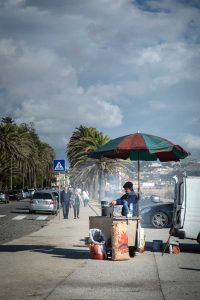 Portugal man selling roasted buts
